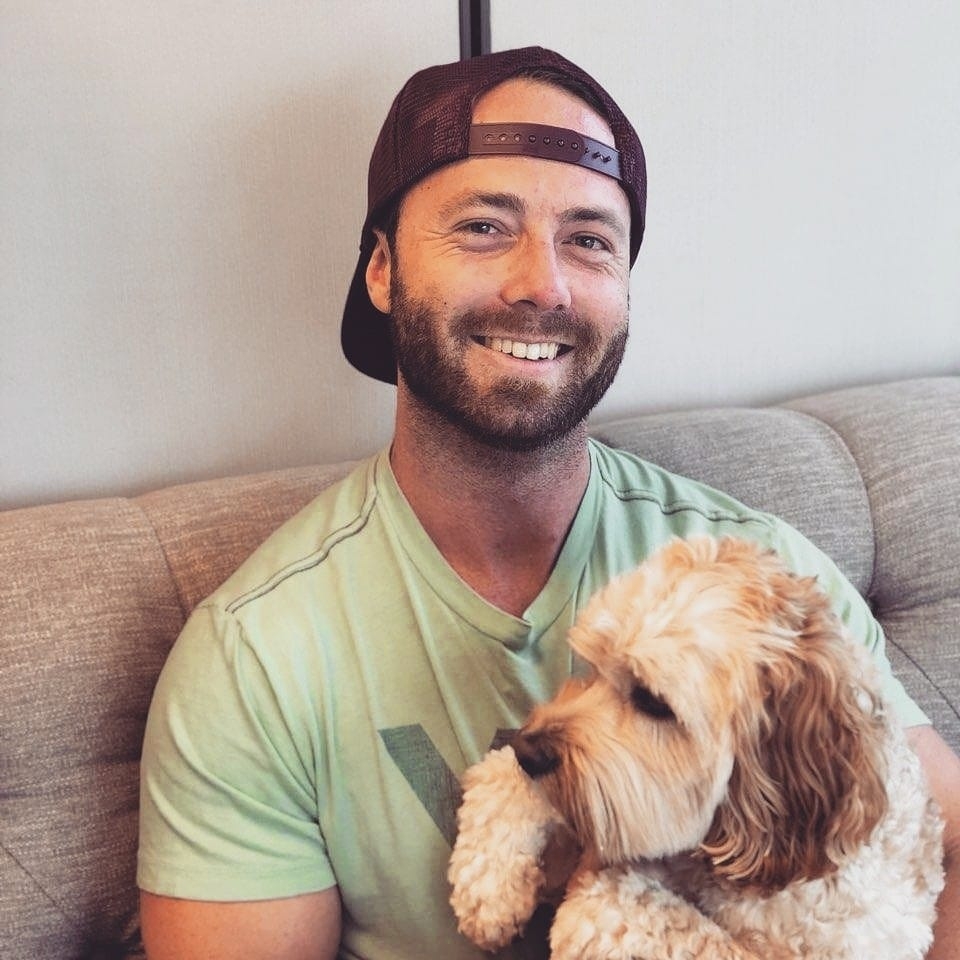 Rob relaxing at home with his dog
